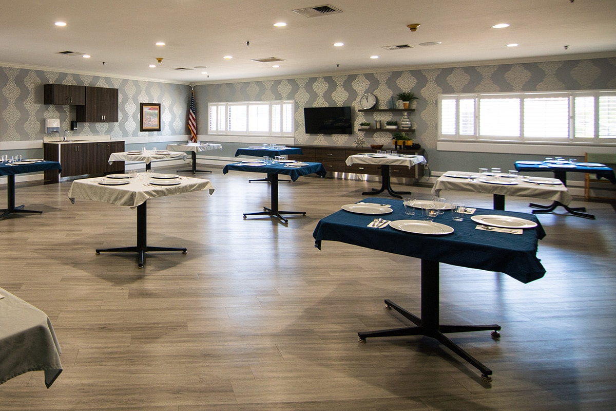 View of dining hall with TV hanging on the wall